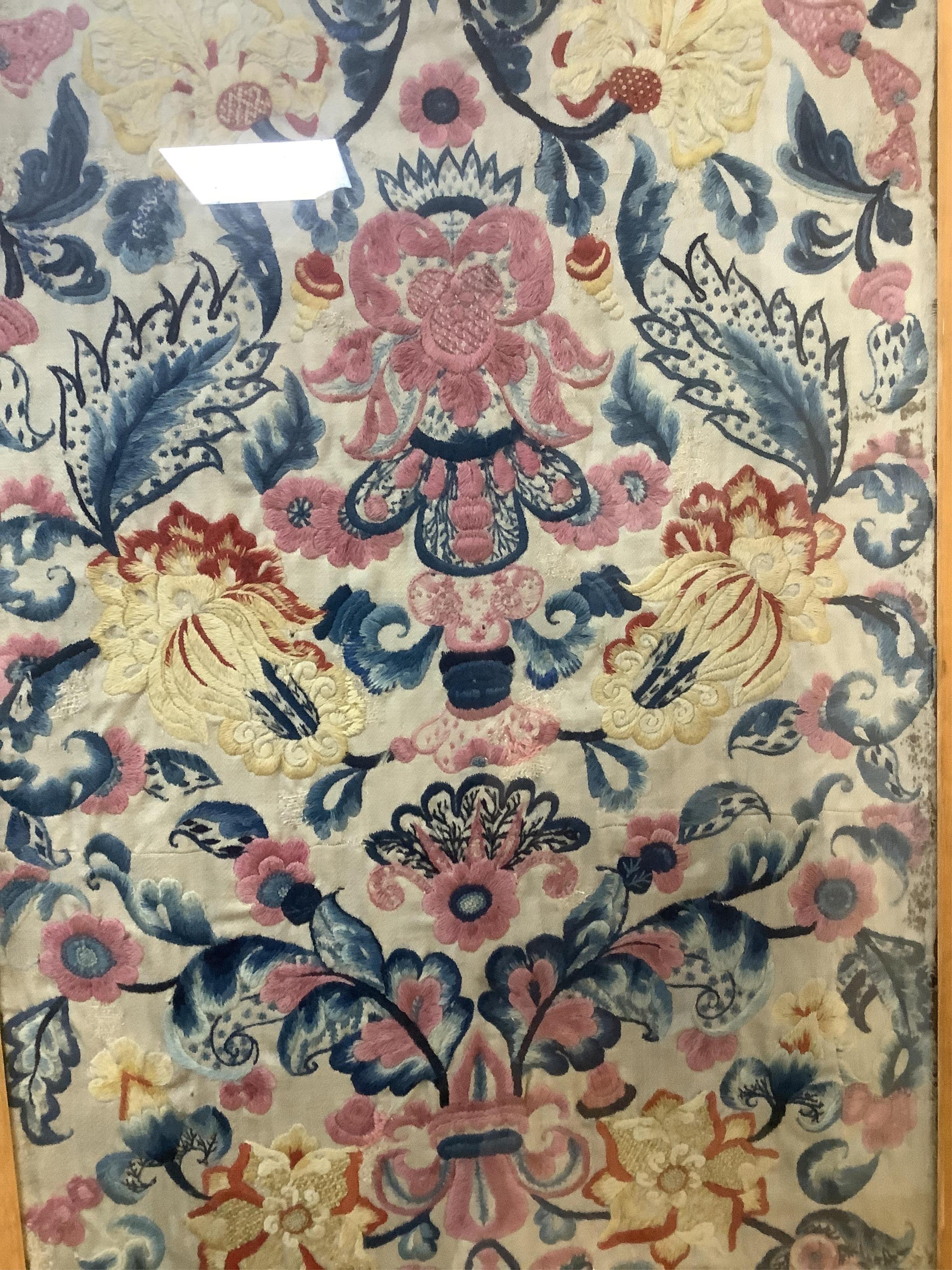 Two unusual 19th- 20th century French crewel worked panels. Embroidered predominantly in shades of blue, pink, yellow and orange, onto a light grey cloth, using neoclassical and rococo design elements. Possibly part of a